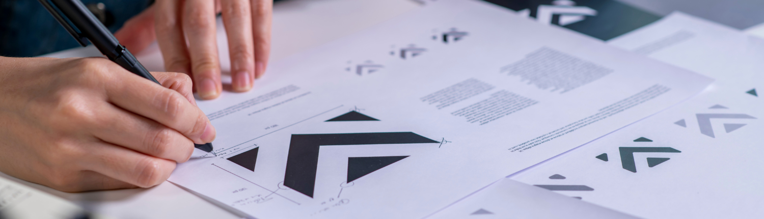 Graphic designer drawing sketches logo design. The concept of a