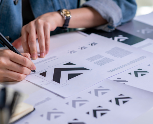 Graphic designer drawing sketches logo design. The concept of a