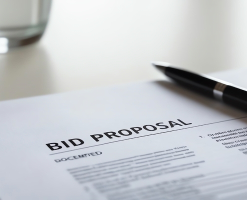 A close-up view of a bid proposal document with a black pen resting on it, showcasing a clean and professional workspace in an office environment. A close up view of a bid proposal document with a black pen resting on it, showcasing a clean and professional workspace in an office environment.